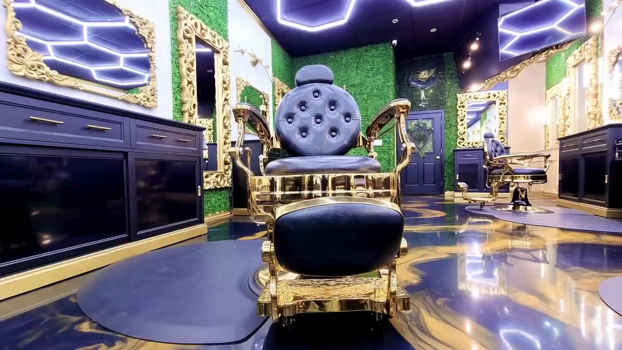 Inside High Quality Cuts — ornate gold and blue barber chairs in a luxury shop